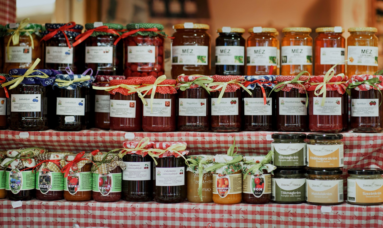 clear glass jars on brown wooden shelf